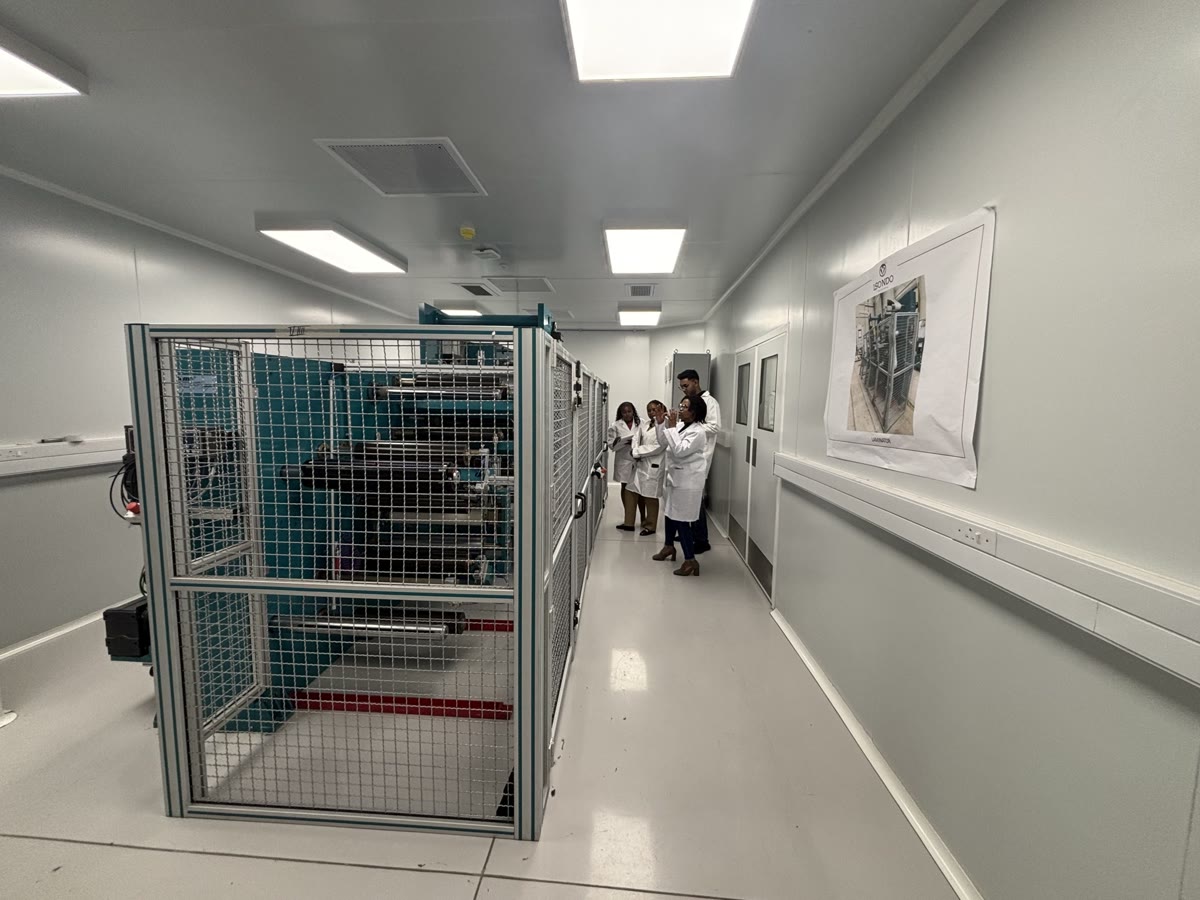 Guarded automated production cell inside the Isondo manufacturing hall.